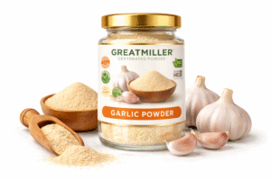 GreatMiller Garlic Powder in glass jar with fresh garlic cloves and ground garlic powder on white background